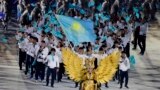 Indonesia Asian Games Opening Ceremony-Kazakhstan's team march into the Gelora Bung Karno Stadium during the opening ceremony for the 18th Asian Games , Jakarta, Indonesia, Saturday, Aug. 18, 2018. (AP Photo/Aaron Favila)